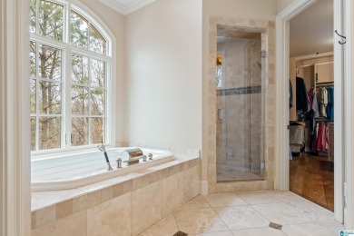 This grand Greystone home is nestled within its wooded  private on Greystone Golf and Country Club-Founders Course in Alabama - for sale on GolfHomes.com, golf home, golf lot