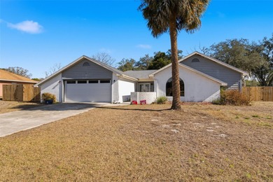 Tucked onto a generous 0.33-acre lot, this inviting 3-bedroom on Spring Hill Golf Course in Florida - for sale on GolfHomes.com, golf home, golf lot