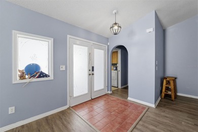 Tucked onto a generous 0.33-acre lot, this inviting 3-bedroom on Spring Hill Golf Course in Florida - for sale on GolfHomes.com, golf home, golf lot