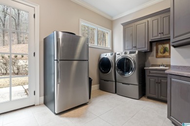 This grand Greystone home is nestled within its wooded  private on Greystone Golf and Country Club-Founders Course in Alabama - for sale on GolfHomes.com, golf home, golf lot