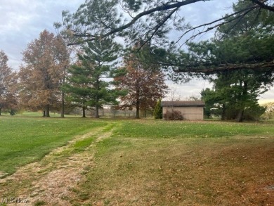 Looking for a large parcel of land with unlimited possibilities! on Rolling Acres Golf Course in Ohio - for sale on GolfHomes.com, golf home, golf lot