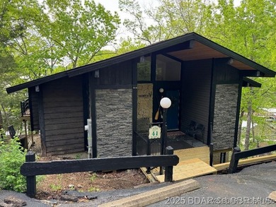 Discover lake living at its finest in the iconic Tan-Tar-A on The Oaks Golf Course in Missouri - for sale on GolfHomes.com, golf home, golf lot