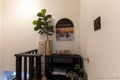 Discover lake living at its finest in the iconic Tan-Tar-A on The Oaks Golf Course in Missouri - for sale on GolfHomes.com, golf home, golf lot