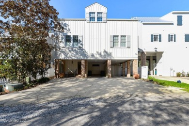 Welcome to this stunning 4-bedroom waterfront retreat, nestled on Diamondhead Country Club in Mississippi - for sale on GolfHomes.com, golf home, golf lot