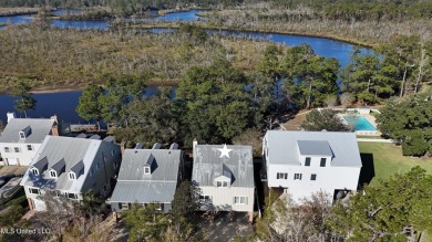 Welcome to this stunning 4-bedroom waterfront retreat, nestled on Diamondhead Country Club in Mississippi - for sale on GolfHomes.com, golf home, golf lot