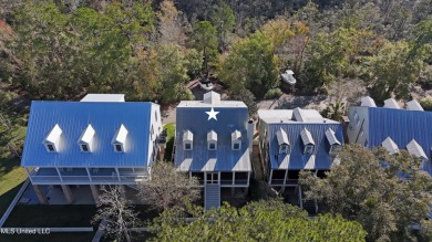 Welcome to this stunning 4-bedroom waterfront retreat, nestled on Diamondhead Country Club in Mississippi - for sale on GolfHomes.com, golf home, golf lot