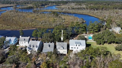 Welcome to this stunning 4-bedroom waterfront retreat, nestled on Diamondhead Country Club in Mississippi - for sale on GolfHomes.com, golf home, golf lot