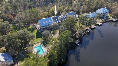 Welcome to this stunning 4-bedroom waterfront retreat, nestled on Diamondhead Country Club in Mississippi - for sale on GolfHomes.com, golf home, golf lot