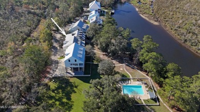 Welcome to this stunning 4-bedroom waterfront retreat, nestled on Diamondhead Country Club in Mississippi - for sale on GolfHomes.com, golf home, golf lot