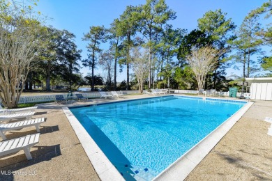 Welcome to this stunning 4-bedroom waterfront retreat, nestled on Diamondhead Country Club in Mississippi - for sale on GolfHomes.com, golf home, golf lot