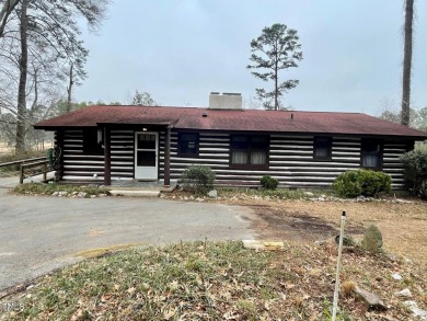 No need to go the mountains!! This  picturesque original log on Carolina Trace Country Club in North Carolina - for sale on GolfHomes.com, golf home, golf lot