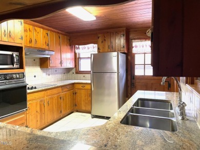 No need to go the mountains!! This  picturesque original log on Carolina Trace Country Club in North Carolina - for sale on GolfHomes.com, golf home, golf lot