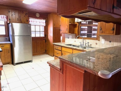No need to go the mountains!! This  picturesque original log on Carolina Trace Country Club in North Carolina - for sale on GolfHomes.com, golf home, golf lot