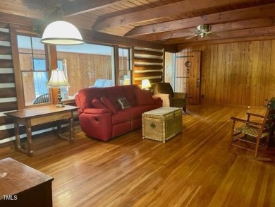 No need to go the mountains!! This  picturesque original log on Carolina Trace Country Club in North Carolina - for sale on GolfHomes.com, golf home, golf lot