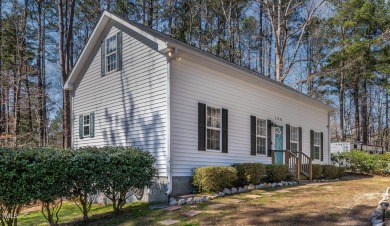 A MUST SEE! Charming 2-Bedroom, 2-Bathroom Cottage in the Gated on River Golf and County Club at Lake Royale in North Carolina - for sale on GolfHomes.com, golf home, golf lot