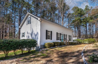 A MUST SEE! Charming 2-Bedroom, 2-Bathroom Cottage in the Gated on River Golf and County Club at Lake Royale in North Carolina - for sale on GolfHomes.com, golf home, golf lot