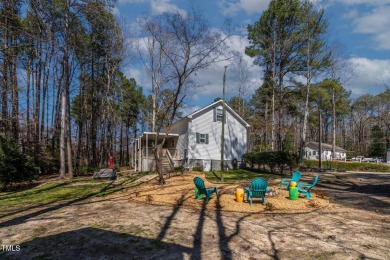 A MUST SEE! Charming 2-Bedroom, 2-Bathroom Cottage in the Gated on River Golf and County Club at Lake Royale in North Carolina - for sale on GolfHomes.com, golf home, golf lot
