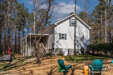 A MUST SEE! Charming 2-Bedroom, 2-Bathroom Cottage in the Gated on River Golf and County Club at Lake Royale in North Carolina - for sale on GolfHomes.com, golf home, golf lot
