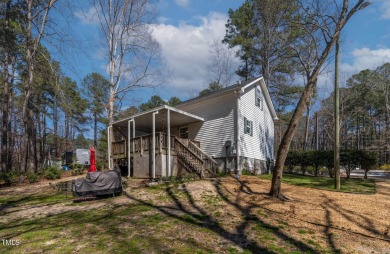 A MUST SEE! Charming 2-Bedroom, 2-Bathroom Cottage in the Gated on River Golf and County Club at Lake Royale in North Carolina - for sale on GolfHomes.com, golf home, golf lot