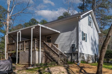 A MUST SEE! Charming 2-Bedroom, 2-Bathroom Cottage in the Gated on River Golf and County Club at Lake Royale in North Carolina - for sale on GolfHomes.com, golf home, golf lot