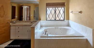 Nestled along the fairway of Hole 9 of the prestigious Oak Hills on Oak Hills Country Club in Florida - for sale on GolfHomes.com, golf home, golf lot