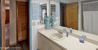 Nestled along the fairway of Hole 9 of the prestigious Oak Hills on Oak Hills Country Club in Florida - for sale on GolfHomes.com, golf home, golf lot