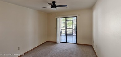 Nestled along the fairway of Hole 9 of the prestigious Oak Hills on Oak Hills Country Club in Florida - for sale on GolfHomes.com, golf home, golf lot