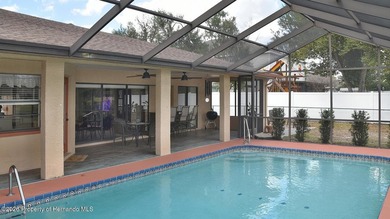 Nestled along the fairway of Hole 9 of the prestigious Oak Hills on Oak Hills Country Club in Florida - for sale on GolfHomes.com, golf home, golf lot