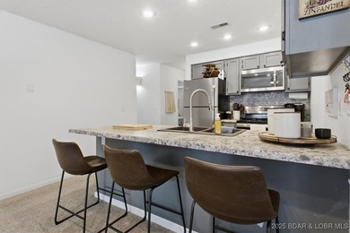 Charming Lakefront Condo in a Small, Sought-After Community! on Seasons Ridge At Four Seasons in Missouri - for sale on GolfHomes.com, golf home, golf lot