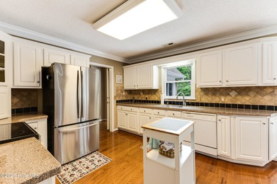 Tucked at the end of a cul-de-sac, this stunning brick home on Lockwood Folly Country Club in North Carolina - for sale on GolfHomes.com, golf home, golf lot