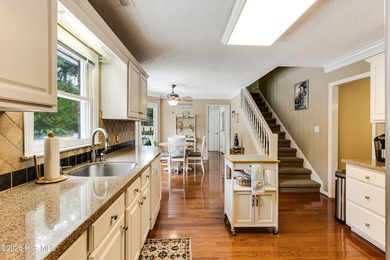 Tucked at the end of a cul-de-sac, this stunning brick home on Lockwood Folly Country Club in North Carolina - for sale on GolfHomes.com, golf home, golf lot