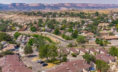 Welcome to this charming townhome located in the highly on The Golf Club At Redlands Mesa in Colorado - for sale on GolfHomes.com, golf home, golf lot