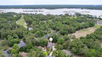 Tucked at the end of a cul-de-sac, this stunning brick home on Lockwood Folly Country Club in North Carolina - for sale on GolfHomes.com, golf home, golf lot