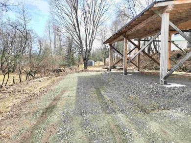 +/- .301 acres of land on an open and level lot with town water on Colebrook Country Club in New Hampshire - for sale on GolfHomes.com, golf home, golf lot
