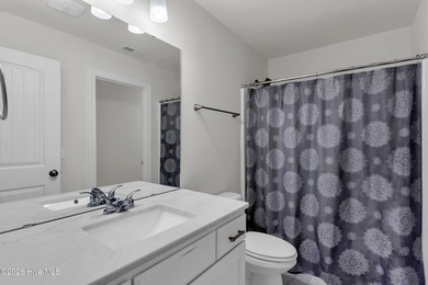 Welcome to 375 Beau Rivage Drive, a charming 3-bedroom, 2.5-bath on Beau Rivage Golf and Resort in North Carolina - for sale on GolfHomes.com, golf home, golf lot