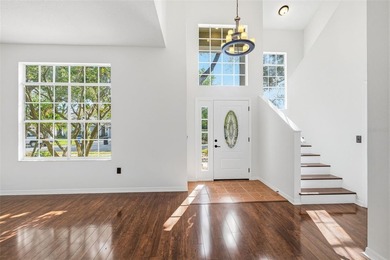 Welcome to this stunning pool home in the guard-gated Hunter's on Hunters Green Country Club in Florida - for sale on GolfHomes.com, golf home, golf lot