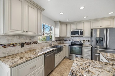 Welcome to this stunning pool home in the guard-gated Hunter's on Hunters Green Country Club in Florida - for sale on GolfHomes.com, golf home, golf lot