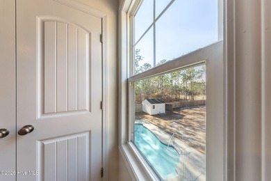 Enjoy life indoors & outdoors in this turnkey 4 bedroom 2 1/2 on The Lakes Country Club in North Carolina - for sale on GolfHomes.com, golf home, golf lot