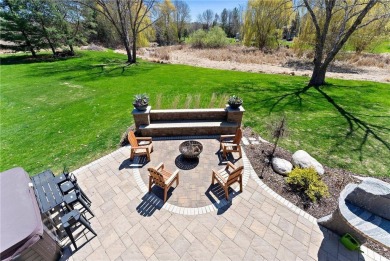 Tucked within the prestigious and serene Lake Riley Woods on Halla Green Executive Golf Course in Minnesota - for sale on GolfHomes.com, golf home, golf lot
