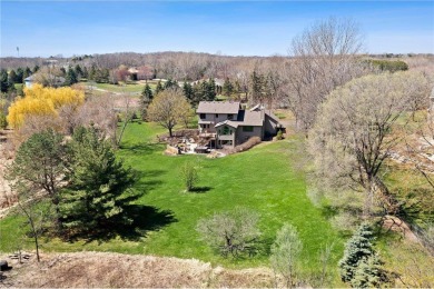 Tucked within the prestigious and serene Lake Riley Woods on Halla Green Executive Golf Course in Minnesota - for sale on GolfHomes.com, golf home, golf lot
