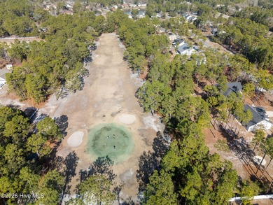 Enjoy life indoors & outdoors in this turnkey 4 bedroom 2 1/2 on The Lakes Country Club in North Carolina - for sale on GolfHomes.com, golf home, golf lot