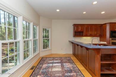 Situated in a peaceful cul-de-sac, this home sits on a large 2 on Pinewild Country Club of Pinehurst in North Carolina - for sale on GolfHomes.com, golf home, golf lot