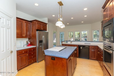 Situated in a peaceful cul-de-sac, this home sits on a large 2 on Pinewild Country Club of Pinehurst in North Carolina - for sale on GolfHomes.com, golf home, golf lot