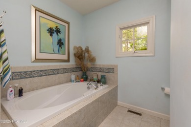 Situated in a peaceful cul-de-sac, this home sits on a large 2 on Pinewild Country Club of Pinehurst in North Carolina - for sale on GolfHomes.com, golf home, golf lot