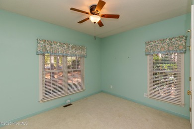 Situated in a peaceful cul-de-sac, this home sits on a large 2 on Pinewild Country Club of Pinehurst in North Carolina - for sale on GolfHomes.com, golf home, golf lot