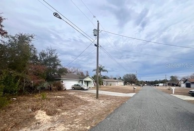 Under contract-accepting backup offers. Set within a calm on Oak Hills Country Club in Florida - for sale on GolfHomes.com, golf home, golf lot