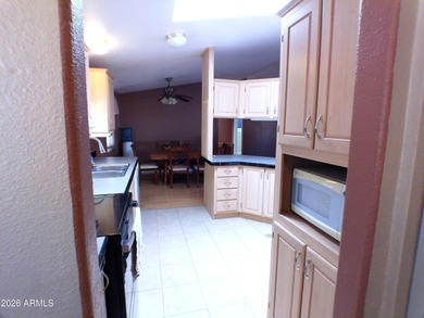 This Stucco 2 Bedroom 2 Full Bath home has an oversized 2nd on Queen Valley Golf Course in Arizona - for sale on GolfHomes.com, golf home, golf lot