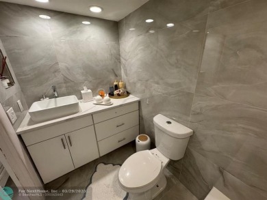 Stunningly remodeled 2/2 condo located in The Oaks at Palm Aire on Palm-Aire Country Club and Resort - The Oaks in Florida - for sale on GolfHomes.com, golf home, golf lot