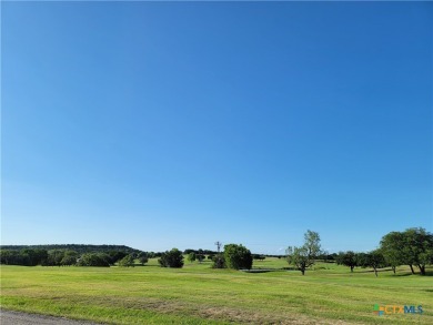 Enjoy a large main living room with a wood-burning fireplace on Hills of Cove Municipal Golf Course in Texas - for sale on GolfHomes.com, golf home, golf lot