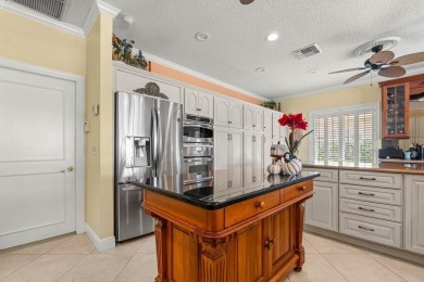Nestled in the prestigious Marlwood Estates of PGA National on PGA National Golf Club in Florida - for sale on GolfHomes.com, golf home, golf lot